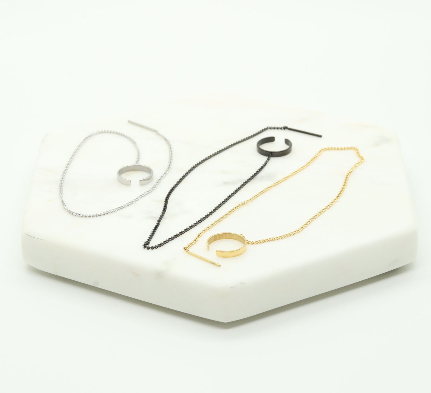 three long chain treaders cuffs, gold, silver and black