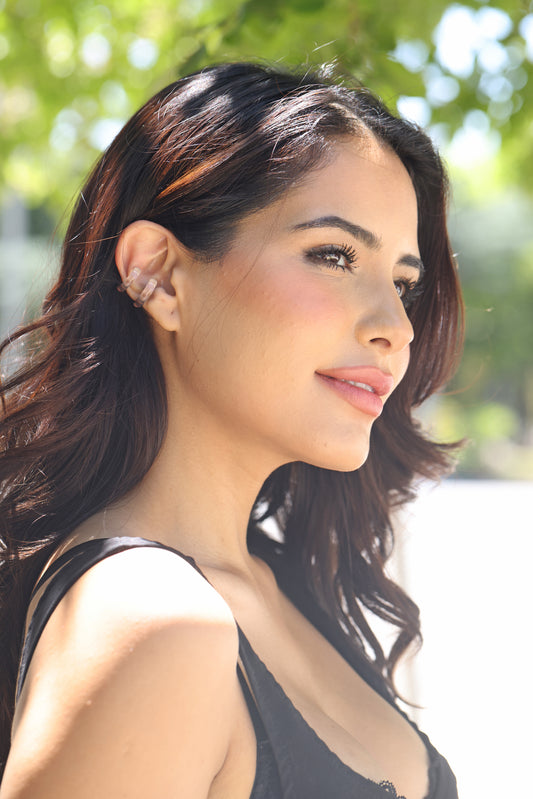  clear q;uartz sar cuff on dark haired female