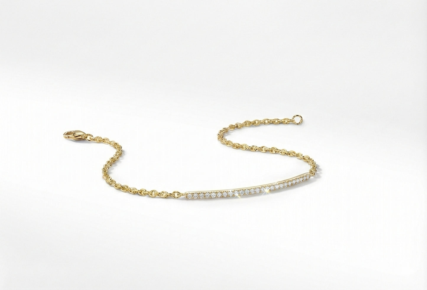 Gold bracelet with small cubic zerconia's on a white background