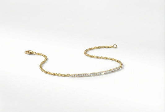 Gold bracelet with small cubic zerconia's on a white background