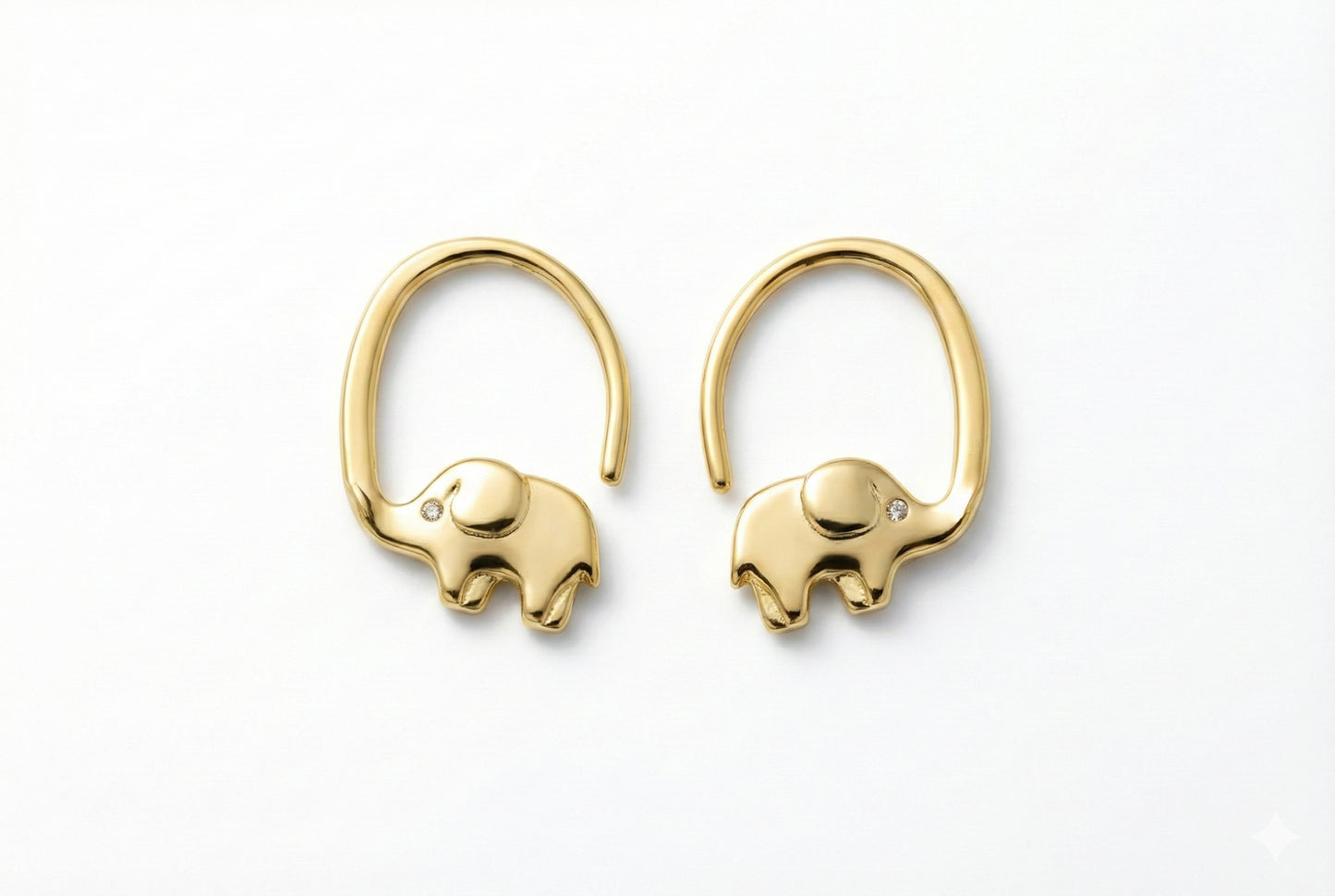 Gold elephant-shaped earrings on a white background