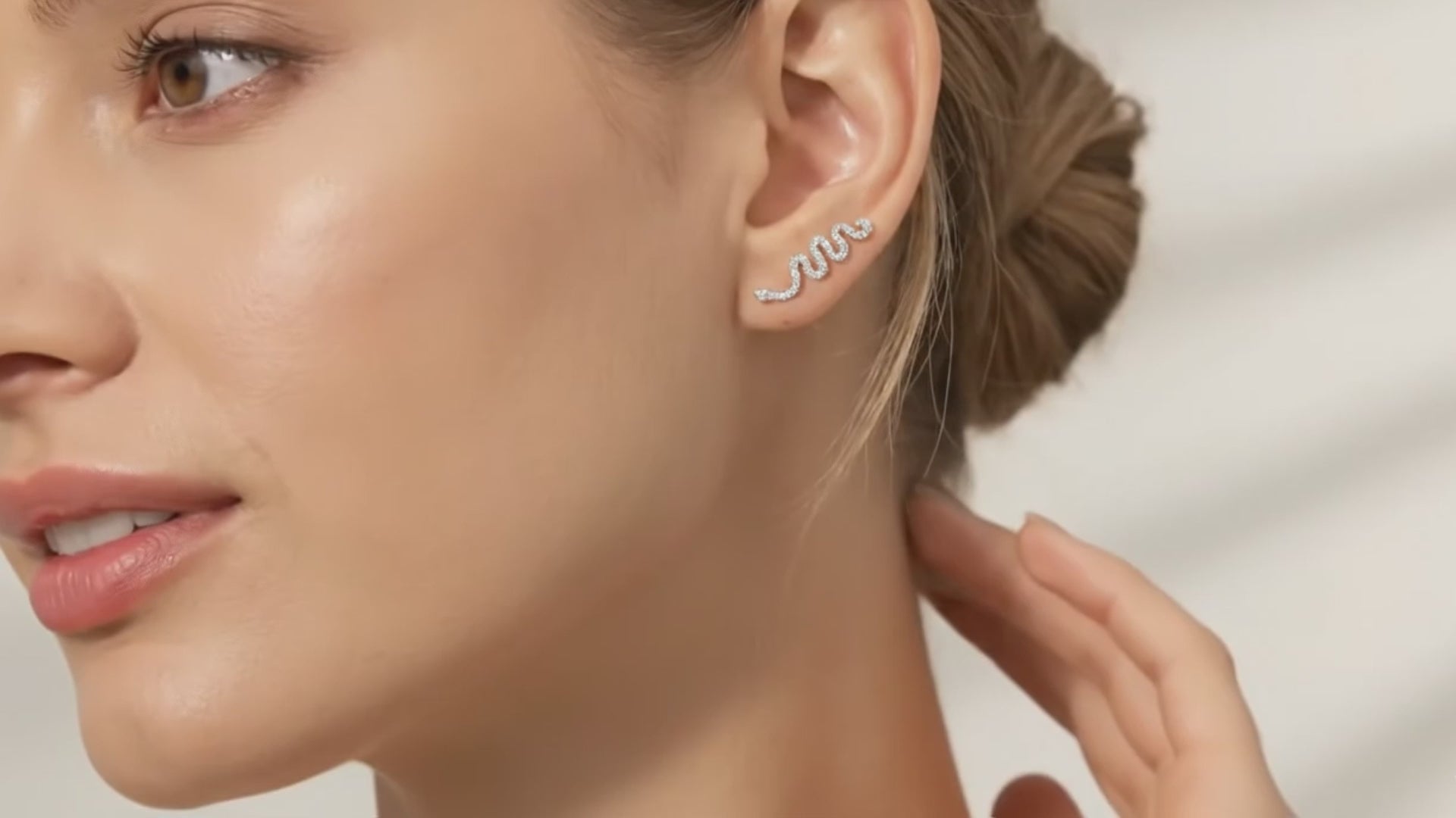 snake earring on a pretty woman