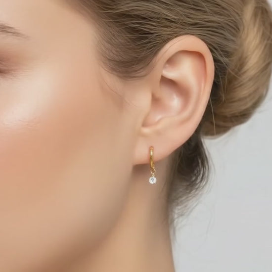 hoop earring with diamond pendent