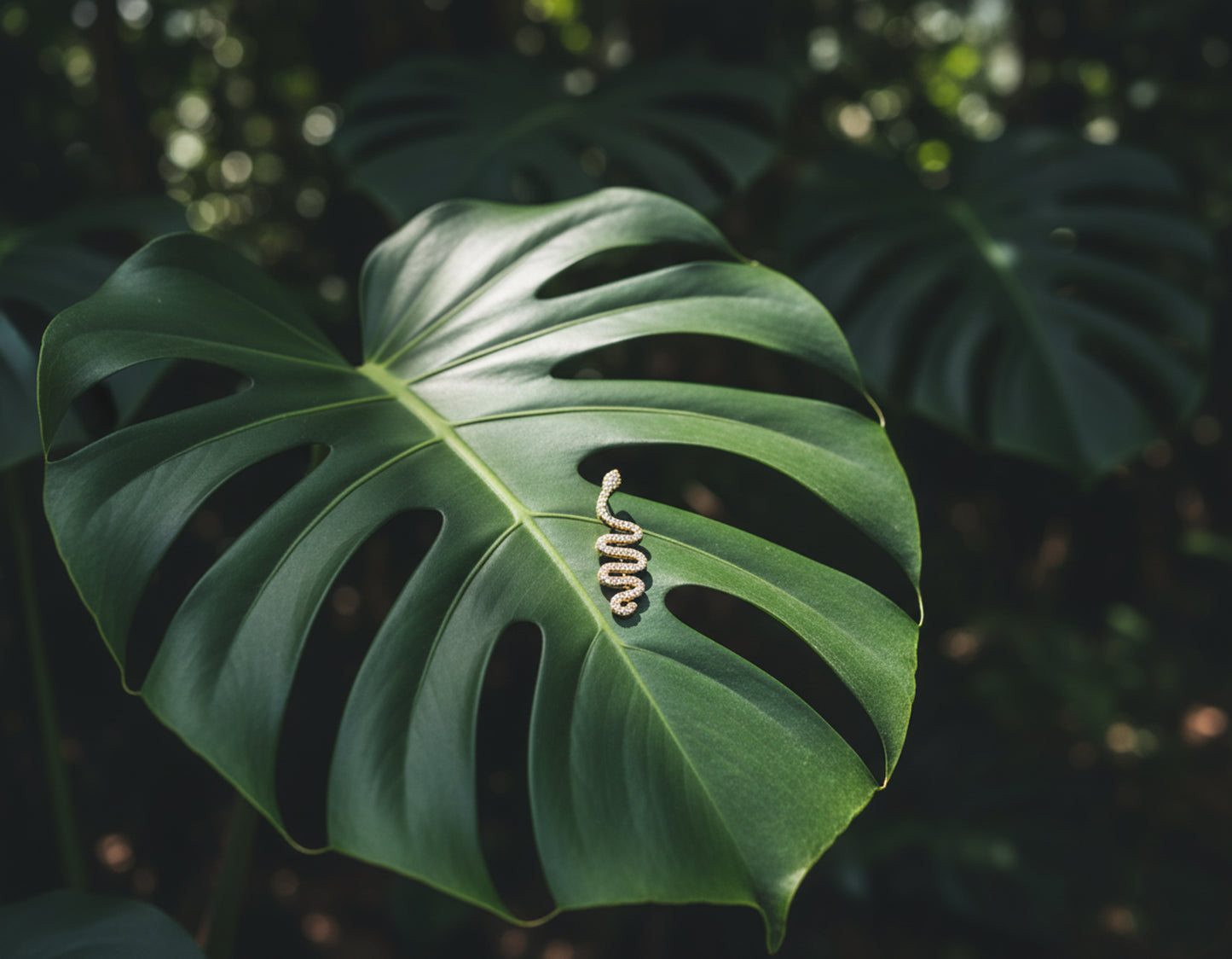 Large green leaf with a snake cuff earring.