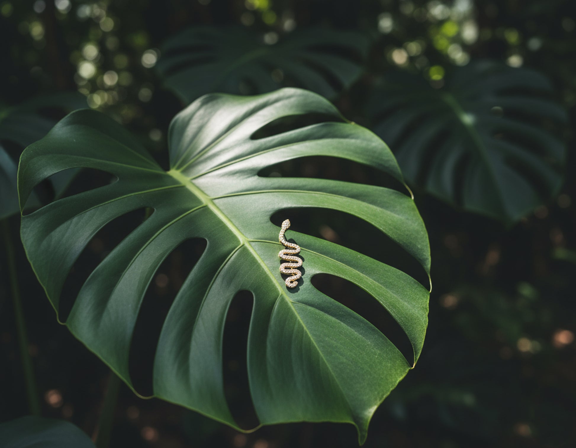 Large green leaf with a snake cuff earring.